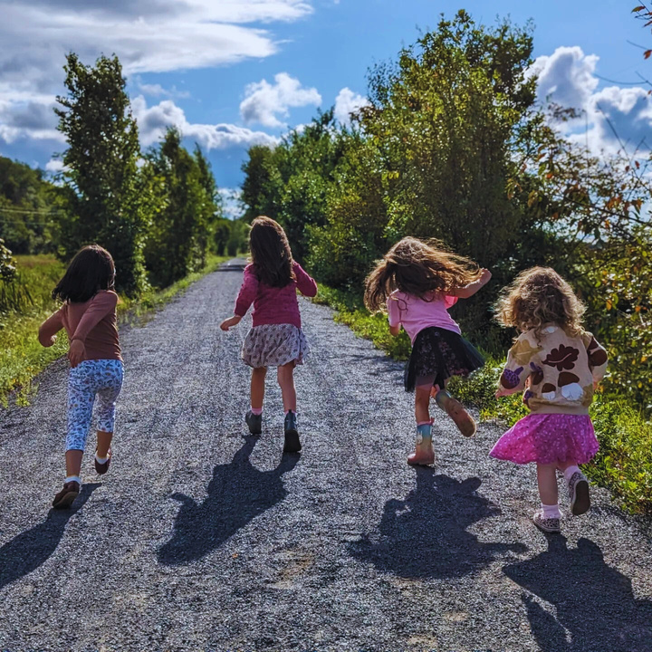 Children walking outdoors in the woods