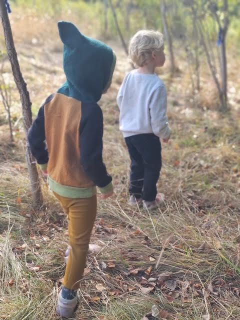 Children rolling dough on a table
