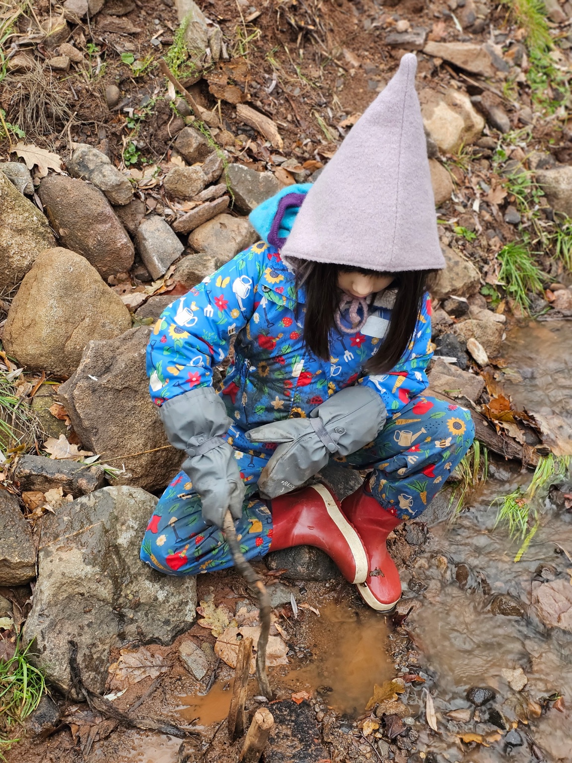 Hands working with wool and felting materials